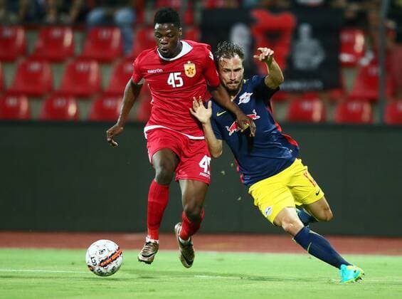 SOCCER - CL, quali, Tirana vs RBS ELBASAN,ALBANIA,26.JUL.16 - SOCCER - UEFA Champions League, qualification, FK Partizani Tirana vs Red Bull Salzburg. Image shows Caleb Ekuban (Tirana) and Andreas Ulmer (RBS). GEPAxpictures xFelixxRoittner