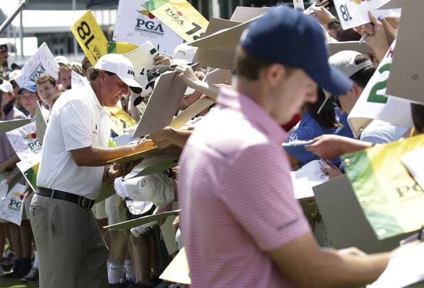 Phil Mickelson and Jordan Spieth sign autographs after his practice round at the PGA Golf Herren Championship at Baltusrol Golf Club in Springfield, New Jersey on July 26, 2016.  PGA20160726105 JOHNxANGELILLO