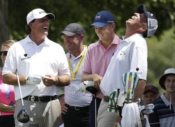 Phil Mickelson, Jordan Spieth and caddie Jim Bones Mackay smile on a tee box in a practice round at the PGA Golf Herren Championship at Baltusrol Golf Club in Springfield, New Jersey on July 26, 2016.  PGA20160726117 JOHNxANGELILLO