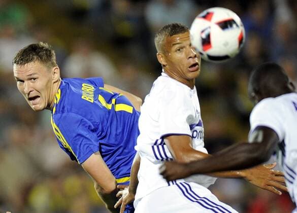 ROSTOV-ON-DON, RUSSIA - JULY 26, 2016: Rostov s Alexander Bukharov (L) and Anderlecht s Sebastian De Maio in action in Leg 1 of their 2016 17 UEFA Champions League Third qualifying round match at Olimp-2 Stadium. The game ended in a 2:2 draw. Valery Matytsin TASS  TS02AF46