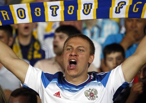 ROSTOV-ON-DON, RUSSIA - JULY 26, 2016: Rostov s fan rooting for their team in Leg 1 of the 2016 17 UEFA Champions League Third qualifying round match against RSC Anderlecht at Olimp-2 Stadium. The game ended in a 2:2 draw. Valery Matytsin TASS  TS02AF47