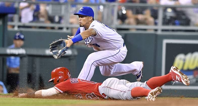 July 26, 2016 - Kansas City, MO, USA - The Los Angeles Angels Johnny Giavotella steals third, sliding under the tag from Kansas City Royals third baseman Cheslor Cuthbert in the eighth inning on Tuesday, July 26, 2016, at Kauffman Stadium in Kansas City, Mo. LA Angels at Kansas City - ZUMAm67_