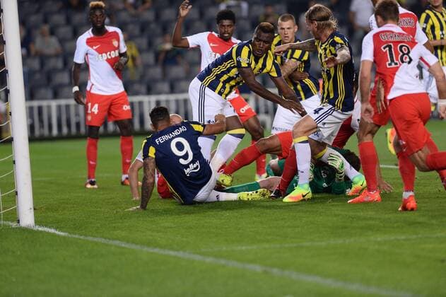 UEFA Champions League Third qualifying round first leg match between Fenerbahce Istanbul and Monaco on July 27, 2016 at the Ulker Stadium in Istanbul,Turkey. Final Score : Fenerbahce 2 - Monaco 1 Pictured: Jose Fernandao , Emmanuel Emenike of Fenerbahce and Goalkeeper Morgan de Sanctis of Monaco. 
