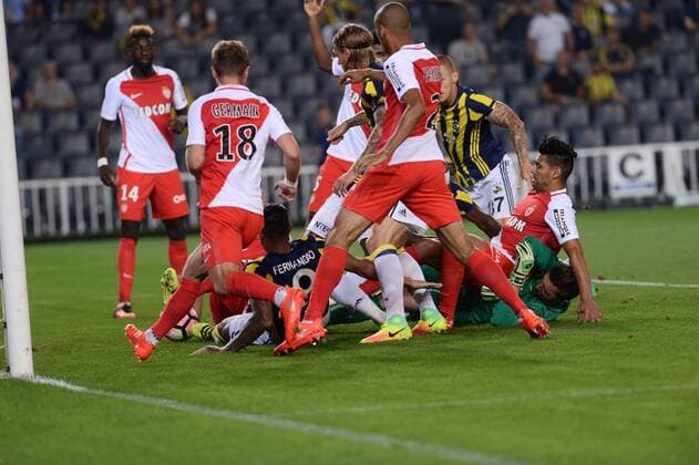 UEFA Champions League Third qualifying round first leg match between Fenerbahce Istanbul and Monaco on July 27, 2016 at the Ulker Stadium in Istanbul,Turkey. Final Score : Fenerbahce 2 - Monaco 1 Pictured: Jose Fernandao , Emmanuel Emenike of Fenerbahce and Goalkeeper Morgan de Sanctis of Monaco. 