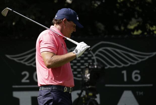 Phil Mickelson reacts after his tee shot on the 16th hole in the first round at the PGA Golf Herren Championship at Baltusrol Golf Club in Springfield, New Jersey on July 28, 2016.  PGA20160728106 JOHNxANGELILLO