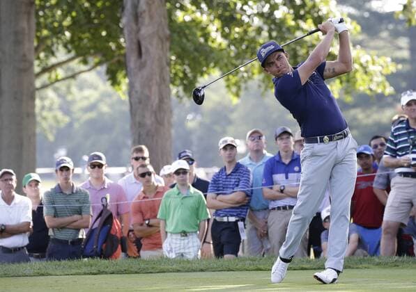 Rickie Fowler hits his tee shot on the 15th hole in the first round at the PGA Golf Herren Championship at Baltusrol Golf Club in Springfield, New Jersey on July 28, 2016.  PGA20160728123 JOHNxANGELILLO