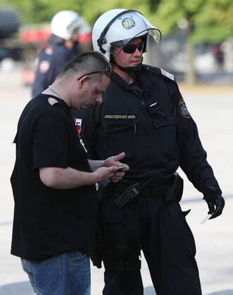SOCCER - EL quali, A.Wien vs Trnava VIENNA,AUSTRIA,28.JUL.16 - SOCCER - UEFA Europa League, qualification, FK Austria Wien vs FC Spartak Trnava. Image shows a policeman and a fan. GEPAxpictures xChristianxOrt
