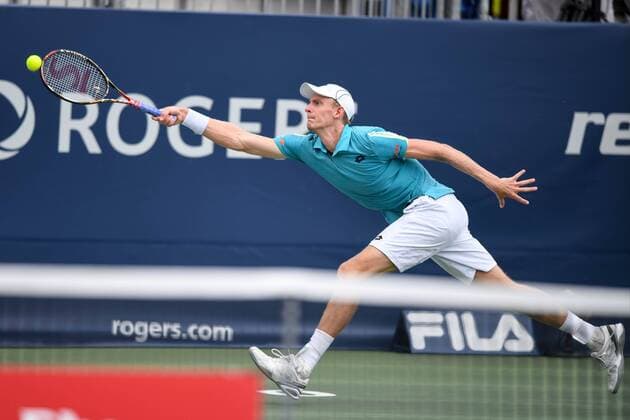 July 28, 2016: Kevin Anderson of South Africa returns the ball to Bernard Tomic of Australia during their third round match of the Rogers Cup tournament at the Aviva Centre in Toronto, Ontario, Canada on July 28, 2016. Cal Media TENNIS 2016 - Rogers Cup Toronto July 28 - ZUMAc04_