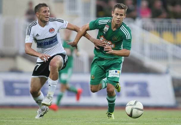 SOCCER - EL quali, Zhodino vs Rapid ZHODZINA,BELARUS,28.JUL.16 - SOCCER - UEFA Europa League, qualification, FC Torpedo Zhodino vs SK Rapid Wien. Image shows Mikhail Afanasiev (Schodsina) and Louis Schaub (Rapid). Keywords: Wien Energie. GEPAxpictures xMarioxKneisl