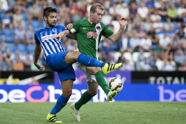 Genk s Sandy Walsh and Cork s Stephen Dooley pictured during the first leg game of the third qualifying round between Belgian first league soccer team KRC Genk and Ireland s Cork City F.C. in the Europa League competition, on Thursday 28 July 2016, in Genk. KRISTOFxVANxACCOM  x04899816x