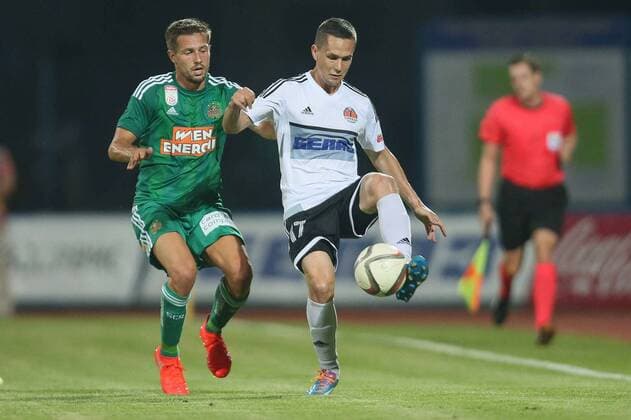 SOCCER - EL quali, Zhodino vs Rapid ZHODZINA,BELARUS,28.JUL.16 - SOCCER - UEFA Europa League, qualification, FC Torpedo Zhodino vs SK Rapid Wien. Image shows Thomas Schrammel (Rapid) and Anton Golenkov (Schodsina). Keywords: Wien Energie. GEPAxpictures xMarioxKneisl