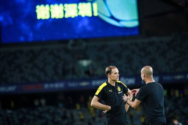 Head coach Pep Guardiola of Manchester City, right, talks to head coach Thomas Tuchel of Borussia Dortmund before the penalty shootout of the Shenzhen match of the 2016 International Champions Cup China in Shenzhen city, south China s Guangdong province, 28 July 2016. Pep Guardiola got his first taste of victory as Manchester City s manager Thursday (28 July 2016) night after beating Borussia Dortmund on penalties in a friendly, but expressed concern about the looming English Premier League season. Football today is tough, said Guardiola, whose side beat their German opposition in the southern Chinese city of Shenzhen. City won, and finally got the workout Guardiola had craved, thanks to a 6-5 penalty shootout win over Dortmund, after the game ended one apiece. City keeper Angus Gunn was the hero of penalties with three saves, including the one sealing their victory when he palmed away Mikel Merino s attempt. Manchester City beat Dortmund on penalties in Shenzhen 20160728_12256