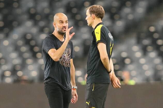 Head coach Pep Guardiola of Manchester City, left, talks to head coach Thomas Tuchel of Borussia Dortmund before the penalty shootout of the Shenzhen match of the 2016 International Champions Cup China in Shenzhen city, south China s Guangdong province, 28 July 2016. Pep Guardiola got his first taste of victory as Manchester City s manager Thursday (28 July 2016) night after beating Borussia Dortmund on penalties in a friendly, but expressed concern about the looming English Premier League season. Football today is tough, said Guardiola, whose side beat their German opposition in the southern Chinese city of Shenzhen. City won, and finally got the workout Guardiola had craved, thanks to a 6-5 penalty shootout win over Dortmund, after the game ended one apiece. City keeper Angus Gunn was the hero of penalties with three saves, including the one sealing their victory when he palmed away Mikel Merino s attempt. Manchester City beat Dortmund on penalties in Shenzhen 20160728_12389