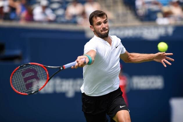 July 29, 2016: Grigor Dimitrov of Bulgaria returns the ball to Kei Nishikori of Japan during their quarter finals match of the Rogers Cup tournament at the Aviva Centre in Toronto, Ontario, Canada on July 29, 2016. Cal Media TENNIS 2016 - Rogers Cup Toronto July 29 - ZUMAc04_