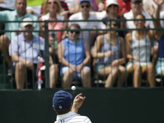 Jordan Spieth throws a golf ball to fans on the first tee box in the 3rd round at the PGA Golf Herren Championship at Baltusrol Golf Club in Springfield, New Jersey on July 30, 2016.  PGA20160730113 JOHNxANGELILLO