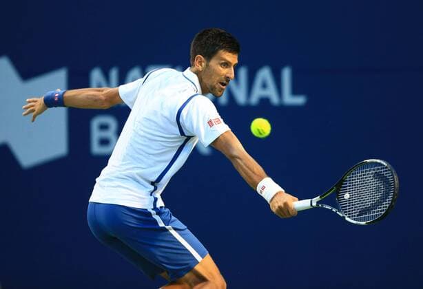 (160731) -- TORONTO, July 30, 2016 -- Novak Djokovic of Serbia returns the ball against Gael Monfils of France during the semifinal match of men s singles at the 2016 Rogers Cup in Toronto, Canada, July 30, 2016. Novak Djokovic won 2-0. ) (SP)CANADA-TORONTO-TENNIS-ROGERS CUP-MEN S SINGLES ZouxZheng 