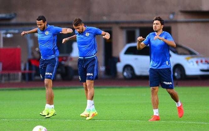 Fenerbahce players during a training session at Stade Louis II Stadium in Monaco on August 02, 2016, a day before their UEFA Champions League Third qualifying round second leg match agaimnst Monaco. Pictured: Josef De Souza (L) , Mehmet Topal (C) and Ozan Tufan (R) 