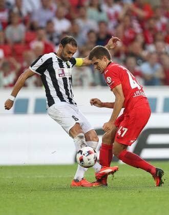 MOSCOW, RUSSIA - AUGUST 4, 2016: AEK Larnaka s David Catala (6, left), and Spartak Moscow s Roman Zobnin (47) in their 2016 2017 UEFA Europa League Third Qualifying Round football match at Otkrytie Arena. Artyom Korotayev TASS  TS02BD17