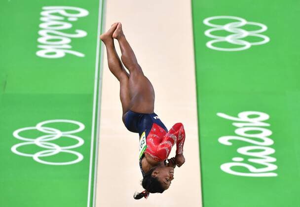 American gymnast Simone Biles competes in the vault qualifications at the 2016 Rio Summer Olympics in Rio de Janeiro, Brazil, August 6, 2016.  OLY20160807302 KEVINxDIETSCH