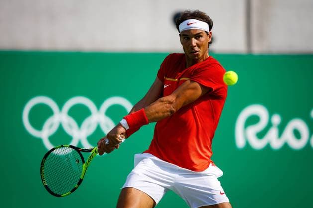 CORRECTS PHOTOGRAPGER Spanish tennis player Rafael Nadal returns the ball to Italian Andreas Seppi during their Olympic Games Olympische Spiele Olympia OS Rio 2016 Men s Tennis Singles Second Round match at the Olympic Tennis Centre in Rio de Janeiro, Brazil, 9 August 2016. RAFAEL NADAL VS. ANDREAS SEPPI !ACHTUNG: NUR REDAKTIONELLE NUTZUNG!  RIO073 20160809-636063794672571743