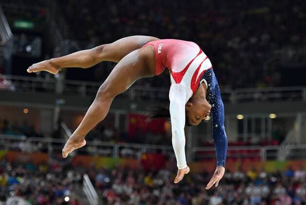 American gymnast Simone Biles competes on the balance beam during the Women s Artistic Gymnastics finals of the 2016 Rio Summer Olympics in Rio de Janeiro, Brazil, August 9, 2016. China, Russia and the United States are expected to battle for the gold medal.  OLY20160809500 KEVINxDIETSCH