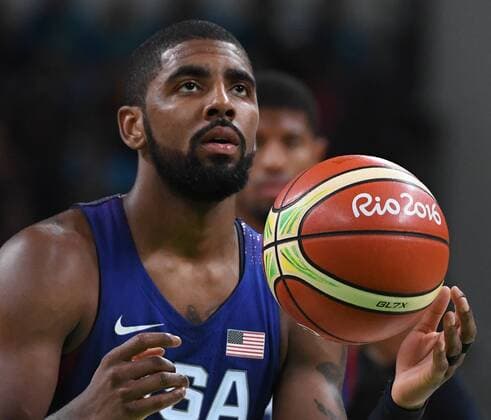 USA s Kyrie Irving spins the basketball before delivering a coffin nail from the free throw line in the closing minute against Australia in Basketball at the 2016 Rio Summer Olympics in Rio de Janeiro, Brazil, August 10, 2016. The USA defeated Australia 98-88.  OLY20160810242 TERRYxSCHMITT