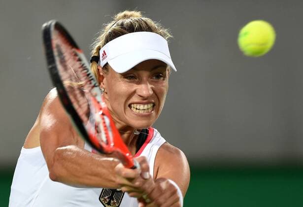 (160812) -- RIO DE JANEIRO, Aug. 12, 2016 -- Germany s Angelique Kerber returns the ball against Madison Keys of the United States of America during the women s singles semifinal of tennis at the 2016 Rio Olympic Games Olympische Spiele Olympia OS in Rio de Janeiro, Brazil, on Aug. 12, 2016. Angelique Kerber won the match 2-0. ) (SP)BRAZIL-RIO DE JANEIRO-OLYMPICS-TENNIS YuexYuewei 