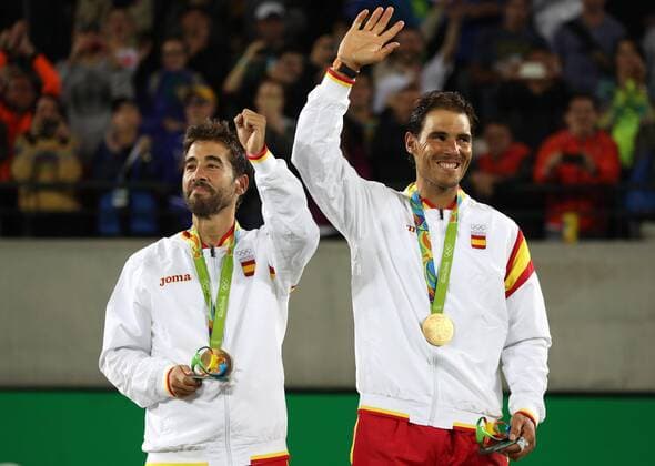 Rafael Nadal (R) and Marc Lopez of Spain celebrate after winning the gold medal in the Rio 2016 Olympic Games Olympische Spiele Olympia OS Men s Doubles at the Olympic Tennis Centre in the Olympic Park in Rio de Janeiro, Brazil, 12 August 2016. Olympic Games 2016 Tennis !ACHTUNG: NUR REDAKTIONELLE NUTZUNG!  JJ00400 20160813-636066558886655887