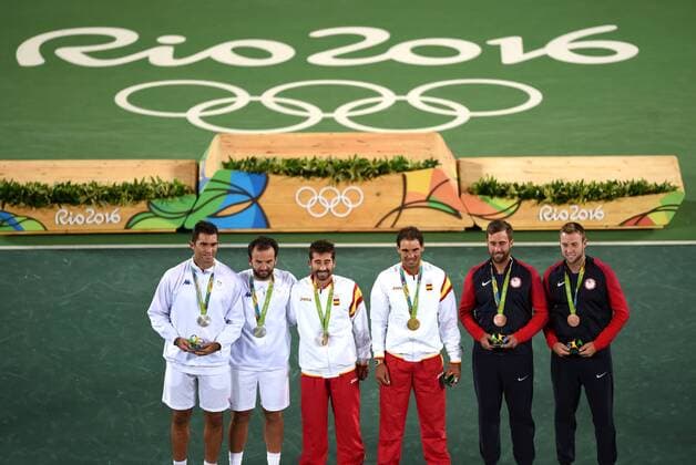 (160812) -- RIO DE JANEIRO, Aug. 12, 2016 -- Rafael Nadal (4th L) and Marc Lopez (3th L) of Spain celebrate at the awarding ceremony of men s doubles tennis at the 2016 Rio Olympic Games Olympische Spiele Olympia OS in Rio de Janeiro, Brazil, on Aug. 12, 2016. Rafael Nadal and Marc Lopez won the gold medal. )(dh) (SP)BRAZIL-RIO DE JANEIRO-OLYMPICS-TENNIS YuexYuewei 