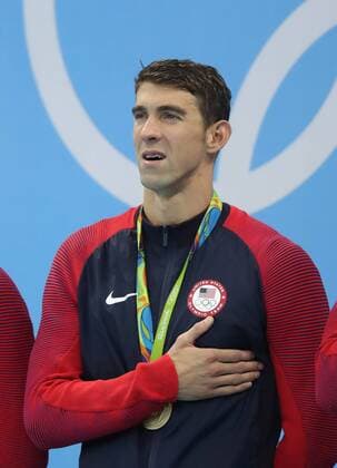 (160813) -- RIO DE JANEIRO, Aug. 13, 2016 -- Michael Phelps of the United States attends at the awarding ceremony of the men s 4x100m medley relay final at the 2016 Rio Olympic Games Olympische Spiele Olympia OS in Rio de Janeiro, Brazil, on Aug. 13, 2016. The United States won the gold medal. )(dh) (SP)BRAZIL-RIO DE JANEIRO-OLYMPICS-SWIMMING CaoxCan 