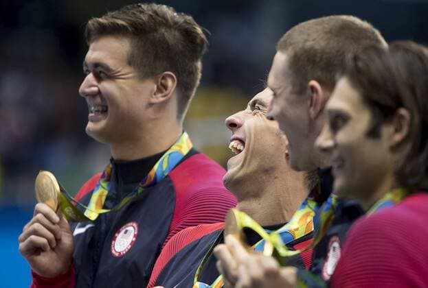 August 13, 2016 - Rio de Janeiro, RJ, Brazil - OLYMPICS SWIMMING: Nathan Adrian (USA), Michael Phelps (USA) Ryan Murphy (USA) and Cody Miller (USA) celebrate during the victory ceremony the gold medal in Men s 4x100m Medley Relay at Olympics Aquatics Stadium during the 2016 Rio Summer Olympics games. .Micheal Phelps (USA) celebrates his 23rd gold medal, and a career total of 28 Olympics medals RIO 2016 - Swimming: Men s - ZUMAj89_
