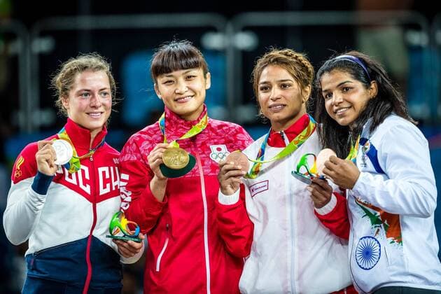 (160817) -- RIO DE JANEIRO, Aug. 17, 2016 -- Gold medalist Japan s Kaori Icho (2nd, L), silver medalist Russia s Valeriia Koblova Zholobova (1st, L), bronze medalists Tunisia s Marwa Amri (2nd, R) and India s Sakshi Malik attend the awarding ceremony for the women s freestyle 58kg category of Wrestling at the 2016 Rio Olympic Games Olympische Spiele Olympia OS in Rio de Janeiro, Brazil, on Aug. 17, 2016. )(xr) (SP)BRAZIL-RIO DE JANEIRO-OLYMPICS-WRESTLING LiuxBin 