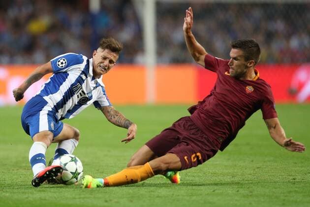 August 17, 2016 - Porto, Porto, Portugal - Porto s Brazilian midfielder Otavio (L) vies with Roma s Netherlands midfielder Kevin Strootman (R) during the UEFA Champions League match between FC Porto and AS Roma, at Dragao Stadium in Porto on August 17, 2016. Porto v AS Roma: UEFA Champions League  - ZUMAn230