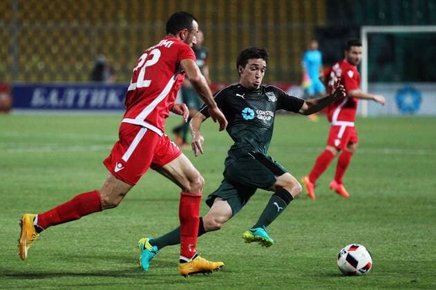 KRASNODAR, RUSSIA - AUGUST 18, 2016: Partizani Tirana s Labinot Ibrahimi (L) and Krasnodar s Vitaly Kaleshin (C) in the first leg of their UEFA Europa League play-off tie at Kuban Stadium. Krasnodar won 4-0. Vitaly Timkiv TASS soccer; Russia; Albania; football  TS02DAA8