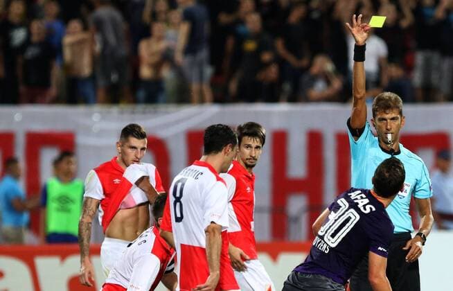 18.08.2016 Novi Sad(Serbia) FK Vojvodina-AZ Alkmaar Europa League play off men s football Paolo Tagliavento(r) Italia referee shoewd yellow card to Stijn Wuytens(second from right) AZ Alkmaar beside Nikola Trujic(L) and Aleksandar Palocevic(c)FK Vojvodina :Str 
