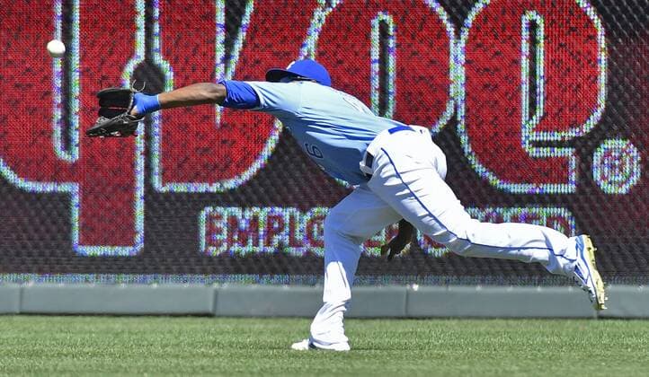 August 21, 2016 - Kansas City, MO, USA - Kansas City Royals right fielder Lorenzo Cain runs down a fly ball out on Minnesota Twins Eddie Rosario in the fourth inning on Sunday, Aug. 21, 2016 at Kauffman Stadium in Kansas City, Mo. Minnesota Twins vs. Kansas City Royals - ZUMAm67_