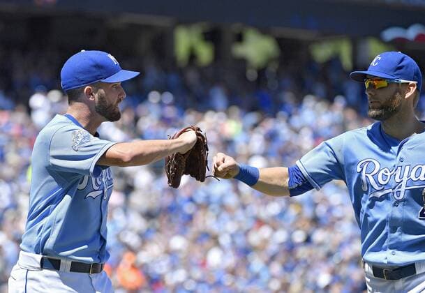 August 21, 2016 - Kansas City, MO, USA - Kansas City Royals starting pitcher Danny Duffy gives left fielder Alex Gordon a fist bump at the end of the second inning after Gordon made a bases loaded sliding catch for an out on Minnesota Twins Kurt Suzuki on Sunday, Aug. 21, 2016 at Kauffman Stadium in Kansas City, Mo. Minnesota Twins vs. Kansas City Royals - ZUMAm67_
