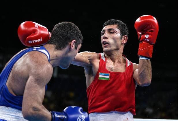 RIO DE JANEIRO, BRAZIL - AUGUST 21, 2016: Russia s Mikhail Aloyan (L) fights against Uzbekistan s Shakhobidin Zoirov in their men s fly 52kg boxing gold medal bout at the Rio 2016 Summer Olympic Games Olympische Spiele Olympia OS at Riocentro Pavilion 6. Zoirov won the bout. Valery Sharifulin TASS  TS02E27E