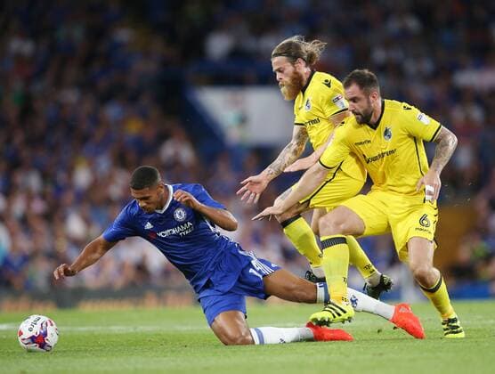 Chelsea s Ruben Loftus-Cheek gets tackled by Bristol Rovers Peter Hartley and Stuart Sinclair during the EFL Cup match at the Stamford Bridge Stadium, London. Picture date August 23rd, 2016 Pic David Klein Sportimage EDITORIAL USE ONLY. No use with unauthorised audio, video, data, fixture lists, club league logos or live services. Online in-match use limited to 120 images, no video emulation. No use in betting, games or single club league player publications.
