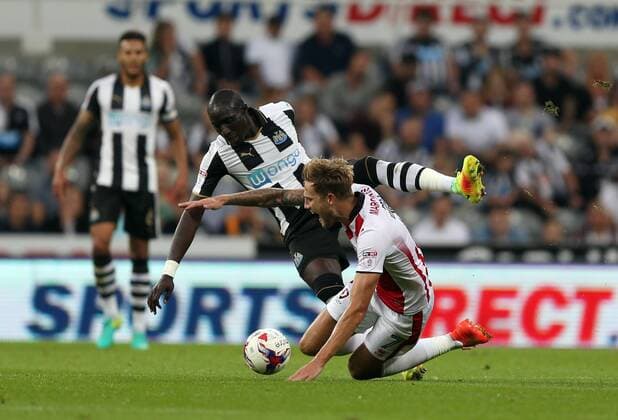. 23 08 2016. Newcastle, United Kingdom. Newcastle United v Cheltenham Town. St James Park. Newcastle United™s Mohamed Diame and Cheltenham Town™s Harry Pell.  xChrisxBoothx xixImagesx IIM-13332-0006
