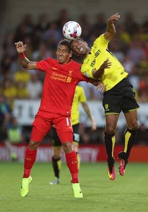 Roberto Firmino of Liverpool challenges Lucas Atkins of Burton Albion for the ball during the Football League Cup Second Round at The Pirelli Stadium. Picture date: August 23rd, 2016. Pic Lynne Cameron Sportimage EDITORIAL USE ONLY. No use with unauthorised audio, video, data, fixture lists, club league logos or live services. Online in-match use limited to 120 images, no video emulation. No use in betting, games or single club league player publications.