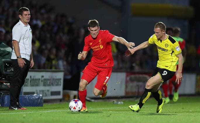 Burton Albion Manager Nigel Clough watches as James Milner of Liverpool holds off Stuart Beavon of Burton Albion during the Football League Cup Second Round at The Pirelli Stadium. Picture date: August 23rd, 2016. Pic Lynne Cameron Sportimage EDITORIAL USE ONLY. No use with unauthorised audio, video, data, fixture lists, club league logos or live services. Online in-match use limited to 120 images, no video emulation. No use in betting, games or single club league player publications.