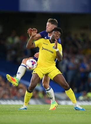 Chelsea s Gary Cahill tussles with Bristol Rovers Ellis Harrison during the EFL Cup match at the Stamford Bridge Stadium, London. Picture date August 23rd, 2016 Pic David Klein Sportimage EDITORIAL USE ONLY. No use with unauthorised audio, video, data, fixture lists, club league logos or live services. Online in-match use limited to 120 images, no video emulation. No use in betting, games or single club league player publications.