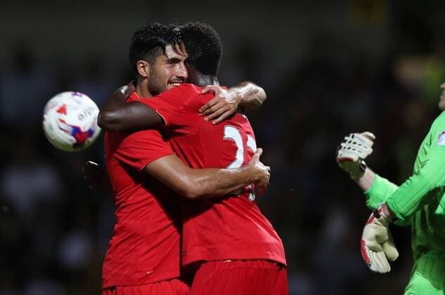 Ere Can and Divock Origi of Liverpool celebrates the third goal of Liverpool scores the second goal during the Football League Cup Second Round at The Pirelli Stadium. Picture date: August 23rd, 2016. Pic Lynne Cameron Sportimage EDITORIAL USE ONLY. No use with unauthorised audio, video, data, fixture lists, club league logos or live services. Online in-match use limited to 120 images, no video emulation. No use in betting, games or single club league player publications.