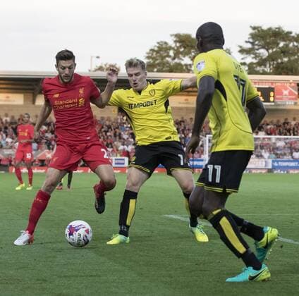 23.08.2016. Pirelli Stadium, Burton on Trent, England. EFL Cup Football. Burton Albion versus Liverpool. Liverpool midfielder Adam Lallana tries to keep possession whilst under pressure from Burton Albion midfielder Damian McCrory and closely watched by Burton Albion midfielder Lloyd Dyer. xRolandxHarrisonx  ActionPlus11779499