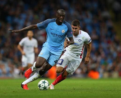 Yaya Toure of Manchester City tussles with Ovidiu Popescu of FC Steaua Bucuresti during the Champions League Play Off 2nd Leg match at the Etihad Stadium, Manchester. Picture date: August 24th, 2016. Pic Simon Bellis Sportimage EDITORIAL USE ONLY. No use with unauthorised audio, video, data, fixture lists, club league logos or live services. Online in-match use limited to 120 images, no video emulation. No use in betting, games or single club league player publications.