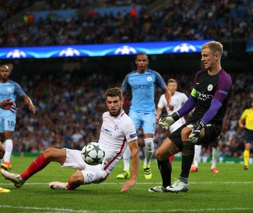 Joe Hart of Manchester City makes a point blank save from Alexandru Tudor of FC Steaua Bucuresti during the Champions League Play Off 2nd Leg match at the Etihad Stadium, Manchester. Picture date: August 24th, 2016. Pic Simon Bellis Sportimage EDITORIAL USE ONLY. No use with unauthorised audio, video, data, fixture lists, club league logos or live services. Online in-match use limited to 120 images, no video emulation. No use in betting, games or single club league player publications.