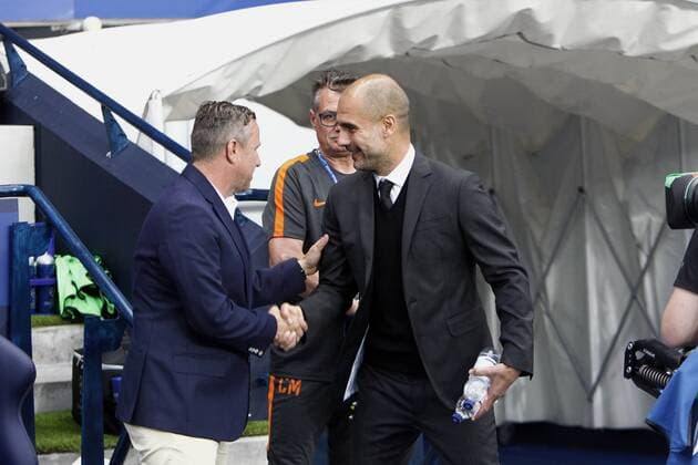 24.08.2016. Etihad Stadium, Manchester, England. Champions League Qualifying Football. Manchester City versus Steaua Bucharest. Manchester City manager Pep Guardiola greets Steaua coach Laurentiu Reghecampf before the game. xAlanxMartinx  ActionPlus11779971
