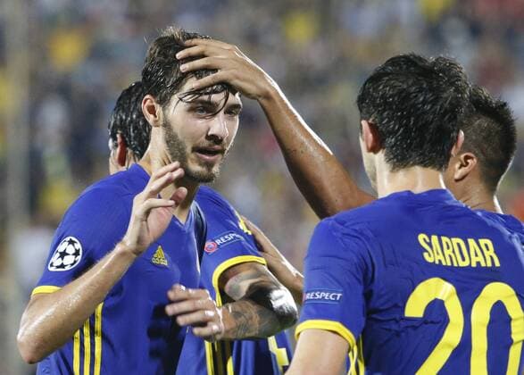 ROSTOV-ON-DON, RUSSIA - AUGUST 24, 2016: Rostov s Alexander Yerokhin (L) and Sardar Azmoun celebrate scoring in the 2016 17 UEFA Champions League First playoff round 2nd leg match against Ajax Amsterdam at Olimp-2 Stadium. FC Rostov won the game 4:1. Valery Matytsin TASS  TS02E7F8