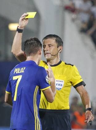 ROSTOV-ON-DON, RUSSIA - AUGUST 24, 2016: Rostov s Dmitry Poloz (L) receives a yellow card in the 2016 17 UEFA Champions League First playoff round 2nd leg match against Ajax Amsterdam at Olimp-2 Stadium. FC Rostov won the game 4:1. Valery Matytsin TASS  TS02E7F9
